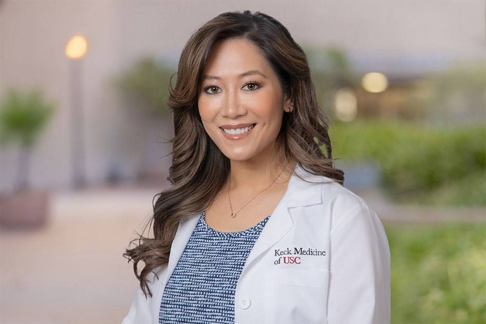 Cynthia Tsay, PA-C, stands outside and smiles.